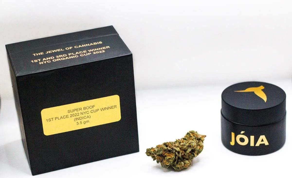 Super Boof box marked 1st place 2022 NYC Cup Winner beside a black Jóia jar and a cured flower